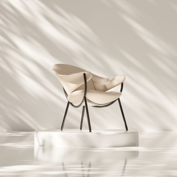 Sculptural white armchair in a bare studio. Photo by Pușcaș Adryan on Pexels