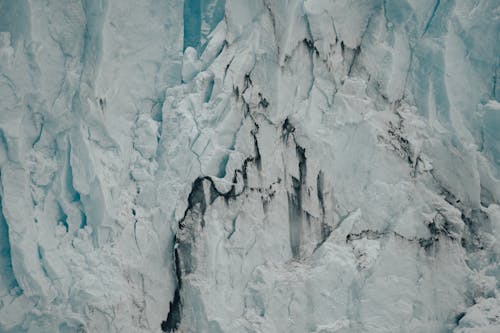 A close up of a glacier with ice and snow