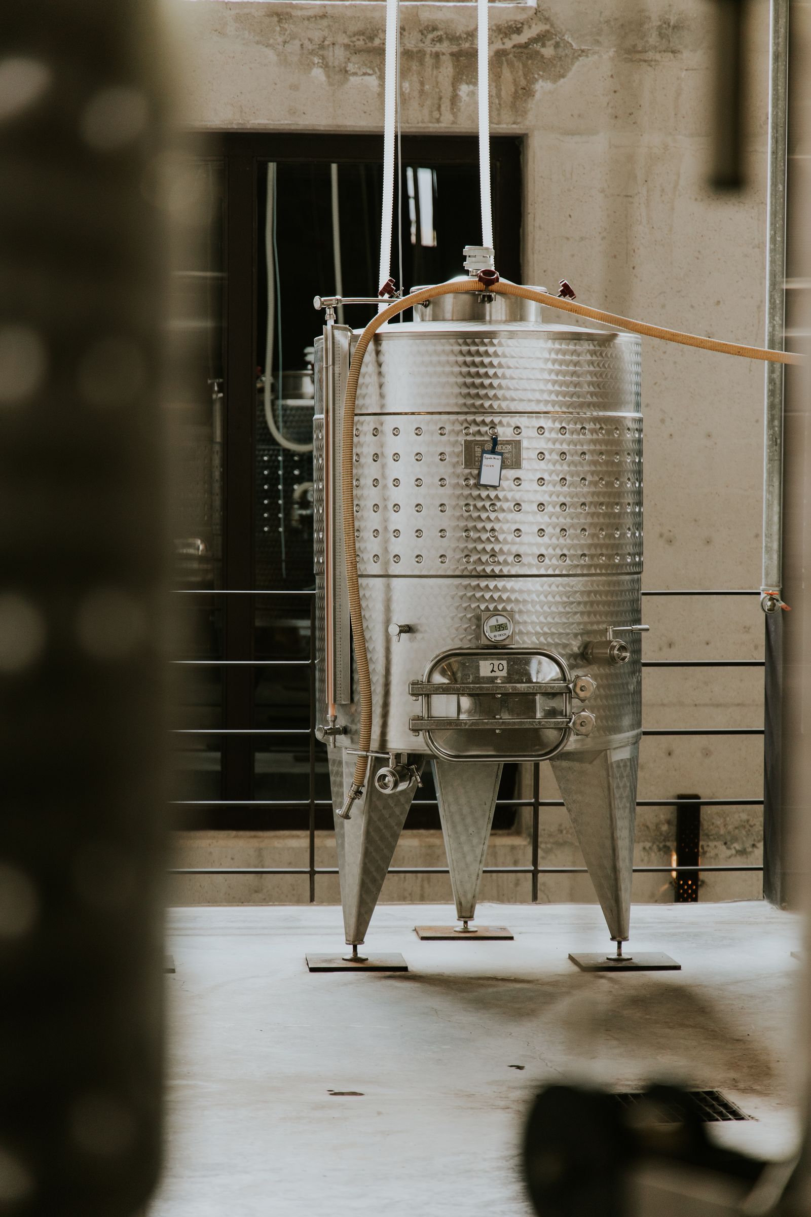 Polished stainless steel process tank in an industrial plant