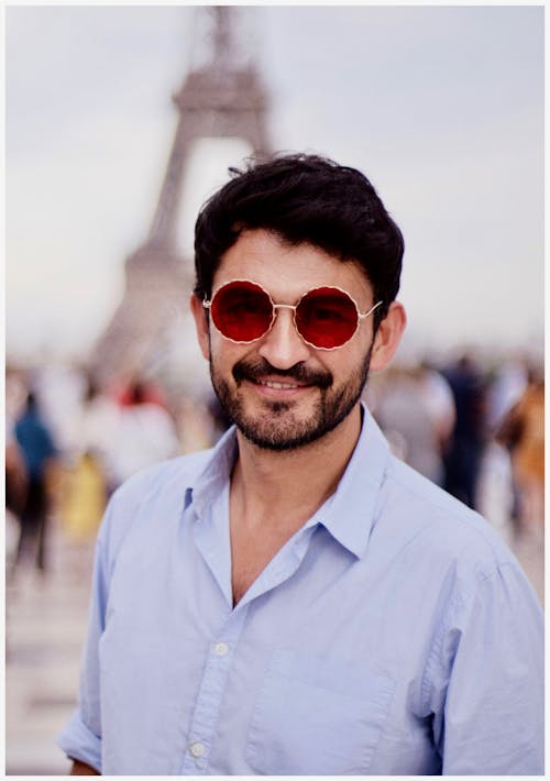 Shallow Focus Photography of Man Wearing Red Sunglasses