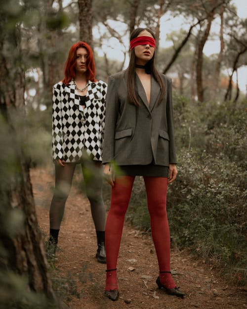Two women in red tights and checkered jackets