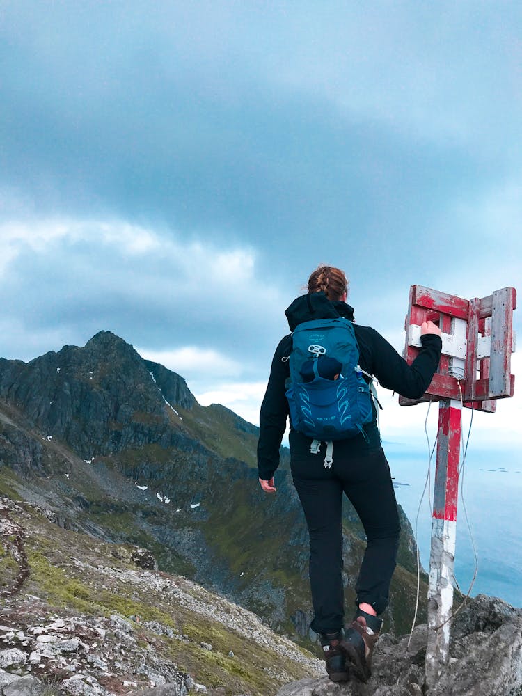 Photo Of A Woman Hiking On Green Mountain