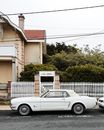 Photo of a Parked White Coupe on The Street
