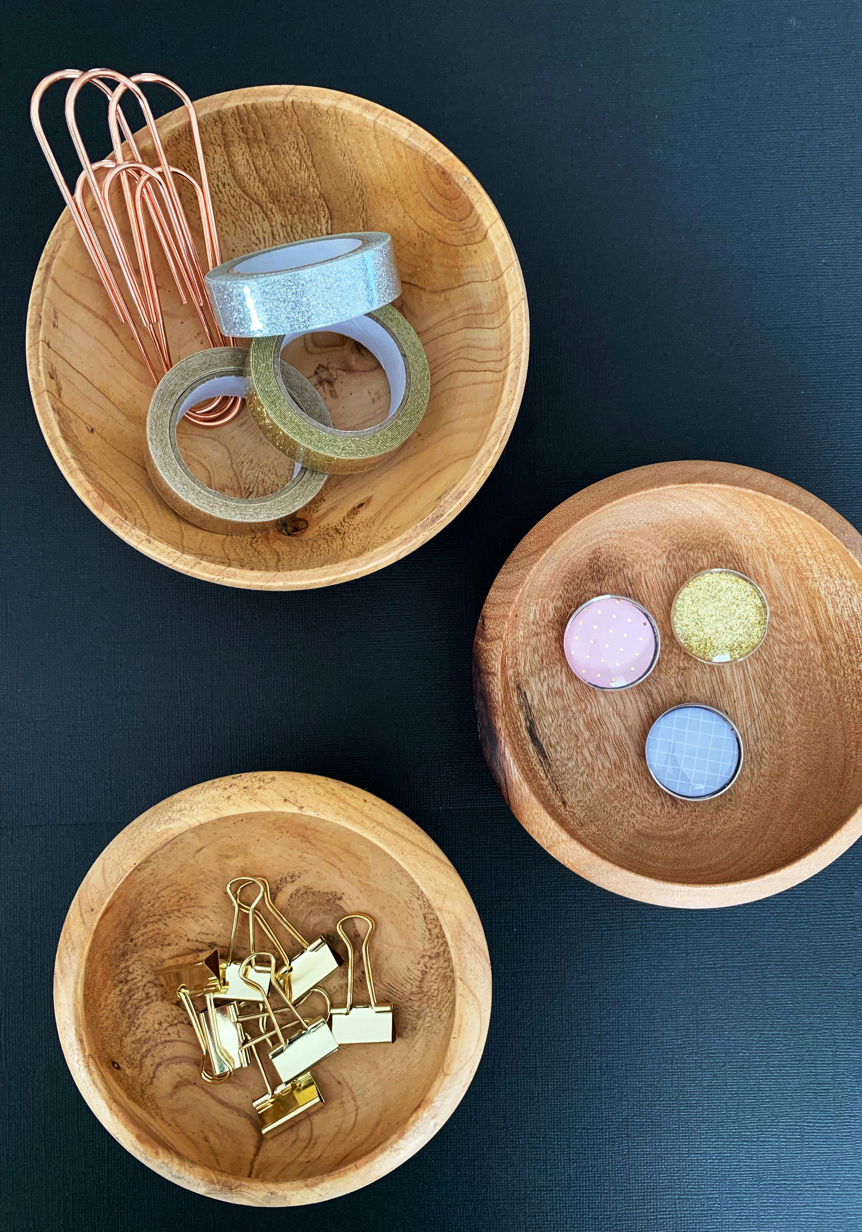 three brown wooden bowls