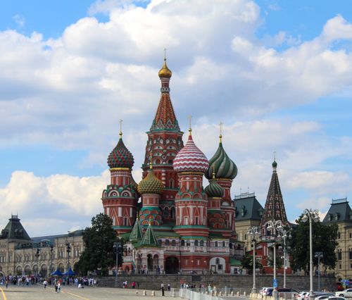 Free Vibrant image of Saint Basil's Cathedral under a clear blue sky, showcasing its colorful domes. Stock Photo