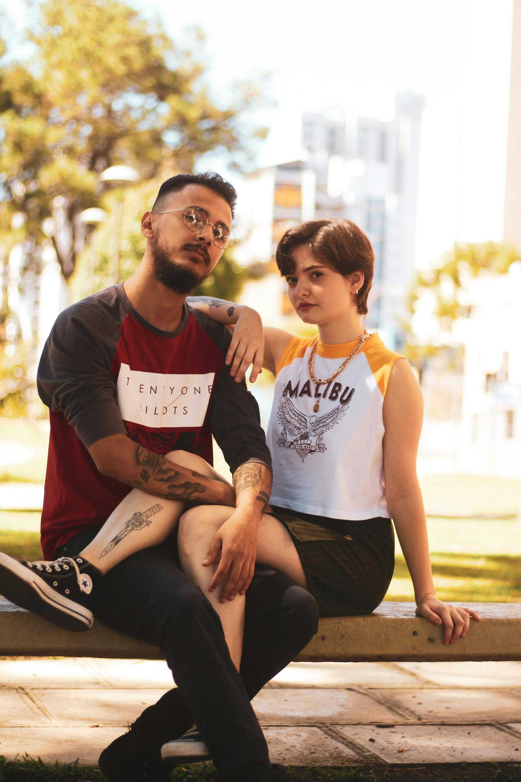Photo Of Couple Sitting On Bench Free Stock Photo