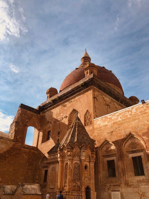 Free Iconic Ishak Pasha Palace with its distinct dome under a clear blue sky in Ağrı, Turkey. Stock Photo