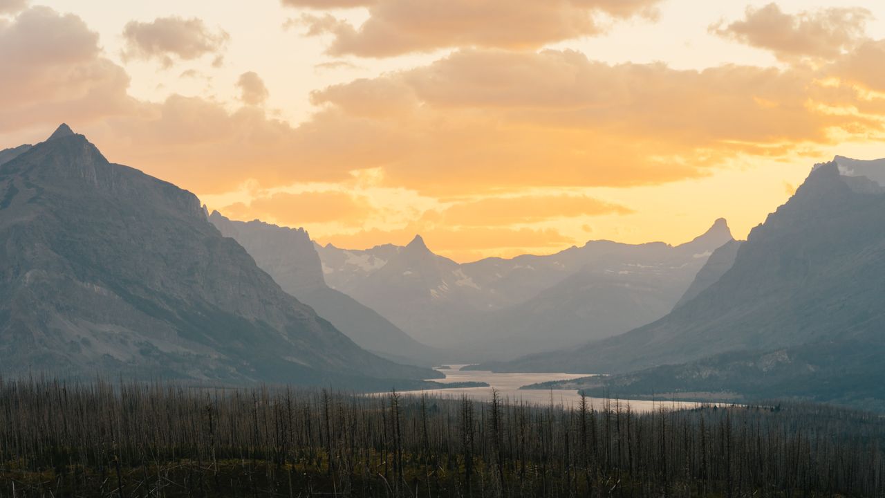 vibrant sunrise at glacier national park highlighting stunning mountai
