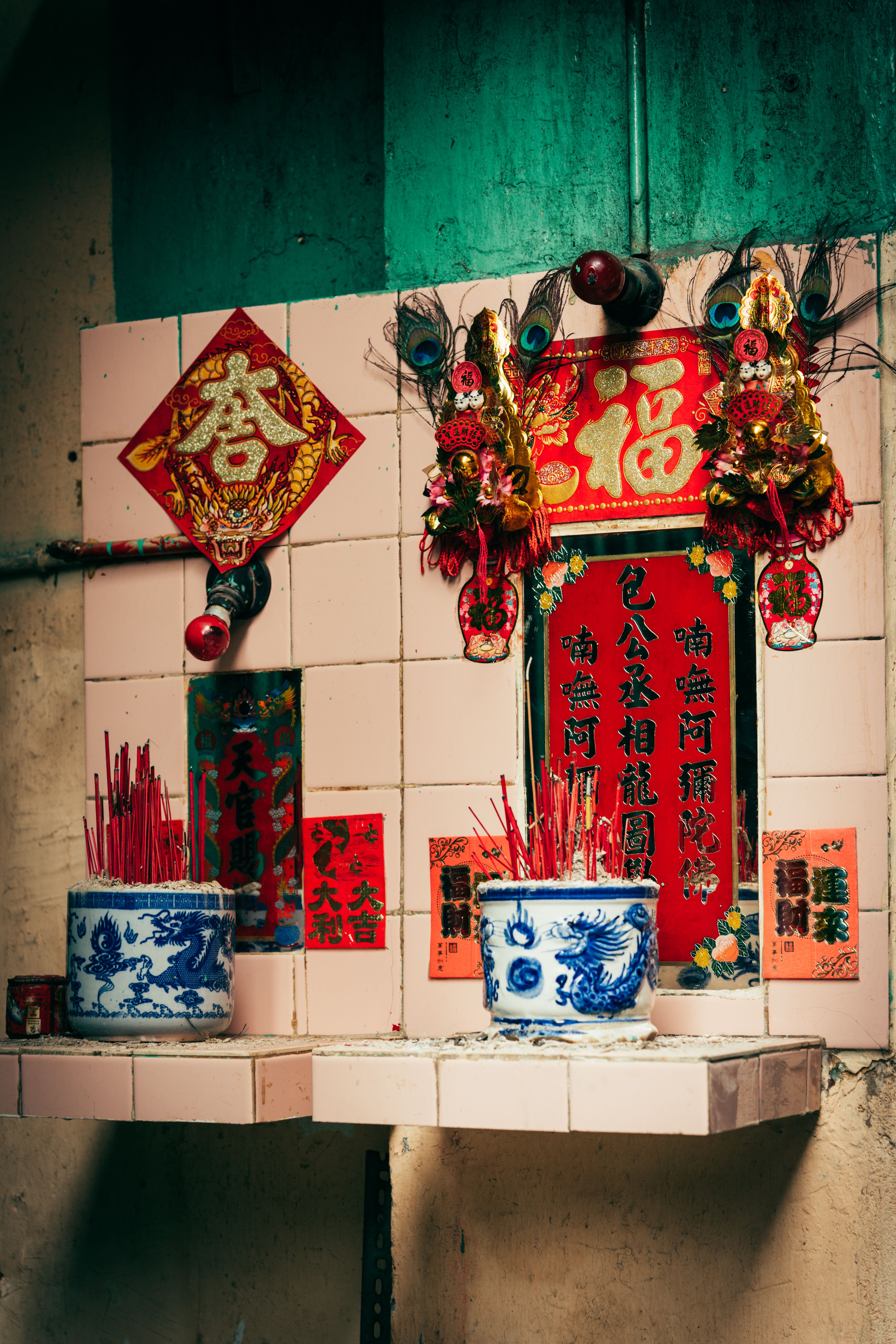 A Vietnamese incense offering table with ornate decorations and vibrant colors in Ho Chi Minh City.