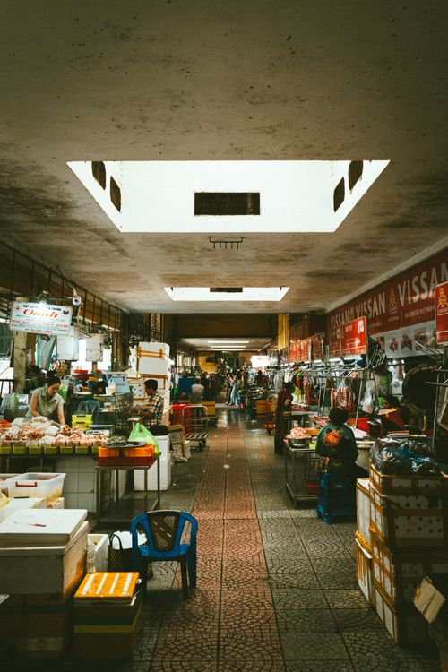 Free Explore the vibrant atmosphere of an indoor market in Ho Chi Minh City with busy vendors and shoppers. Stock Photo
