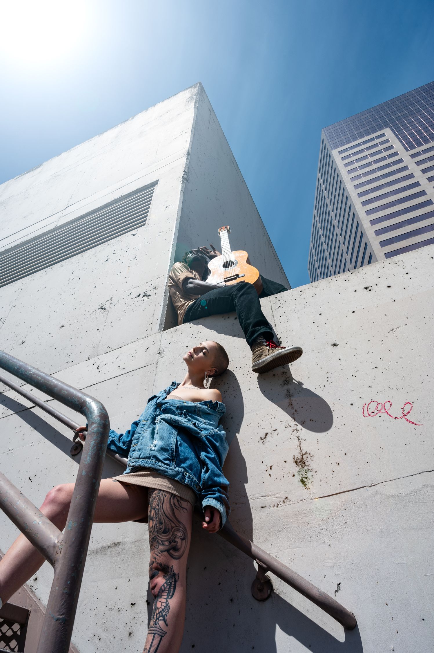 Woman In Blue Denim Jacket And Beige Skirt Standing On Stairs Free woman-in-blue-denim-jacket-and-beige-skirt-standing-on-stairs-free