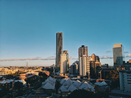 Free A stunning view of Brisbane's modern skyline featuring towering skyscrapers against a clear blue sky. Stock Photo