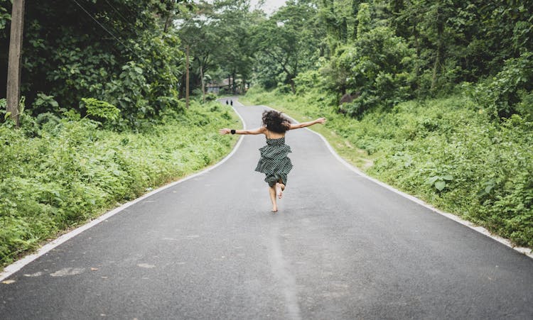 Woman Running On Road