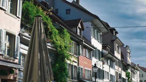 Charming street with outdoor dining in Winterthur, Switzerland, capturing European architecture and urban life.