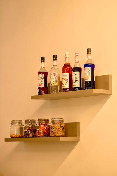 A shelf with bottles and jars on it