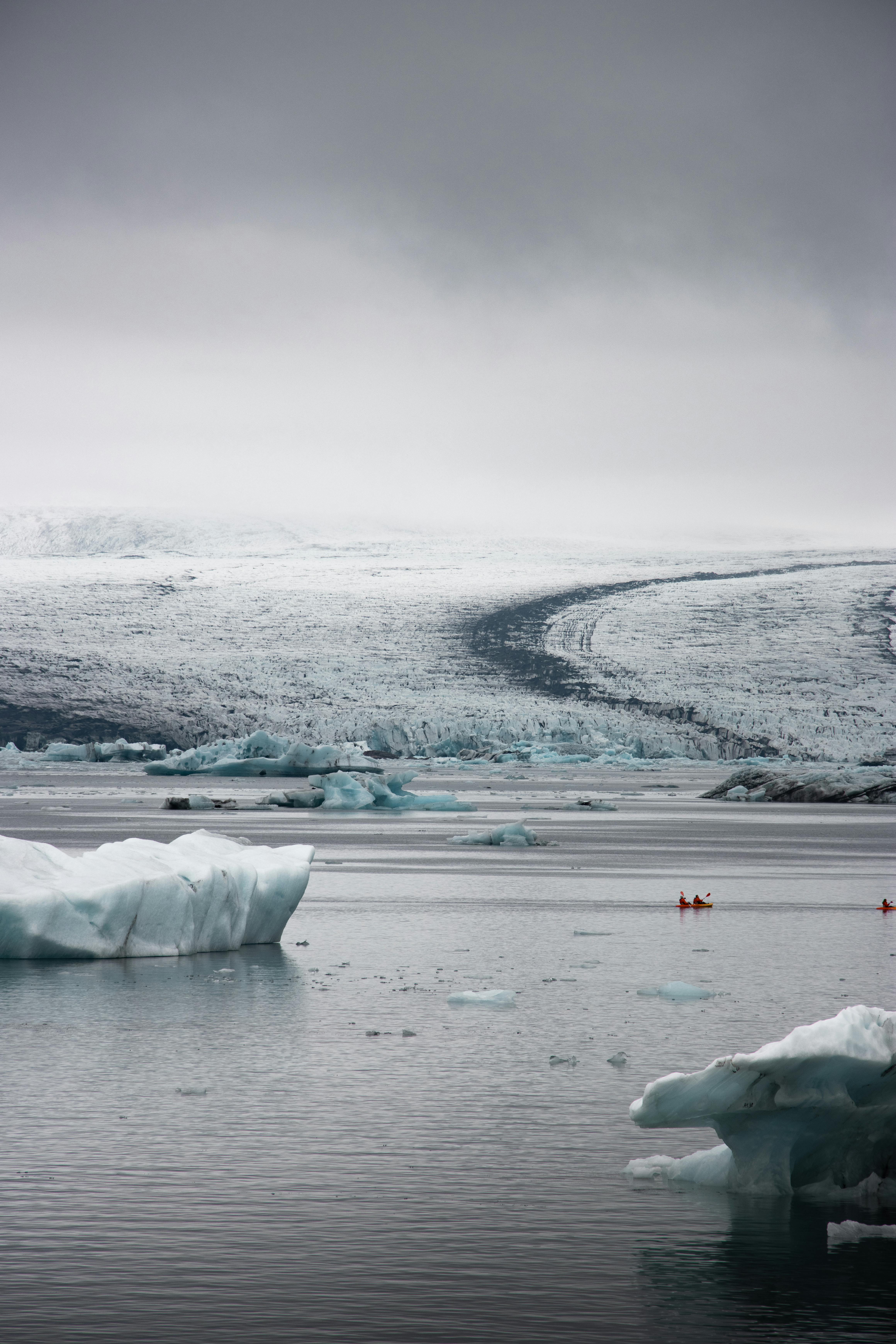 Majestic icy landscape at Vík í Mýrdal, capturing glaciers and tranquil waters in winter.