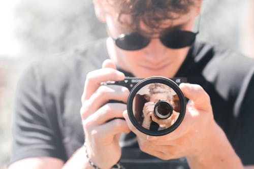 Man Holding Black Camera Close-up Photography