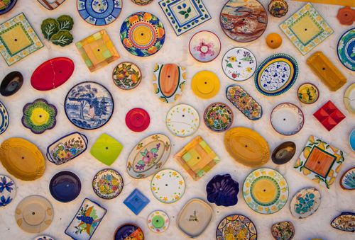 Free Colorful array of decorative ceramic plates exhibited in Faro, Portugal. Stock Photo