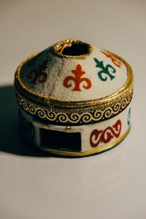 Free Decorative yurt model with traditional motifs on a white background. Stock Photo
