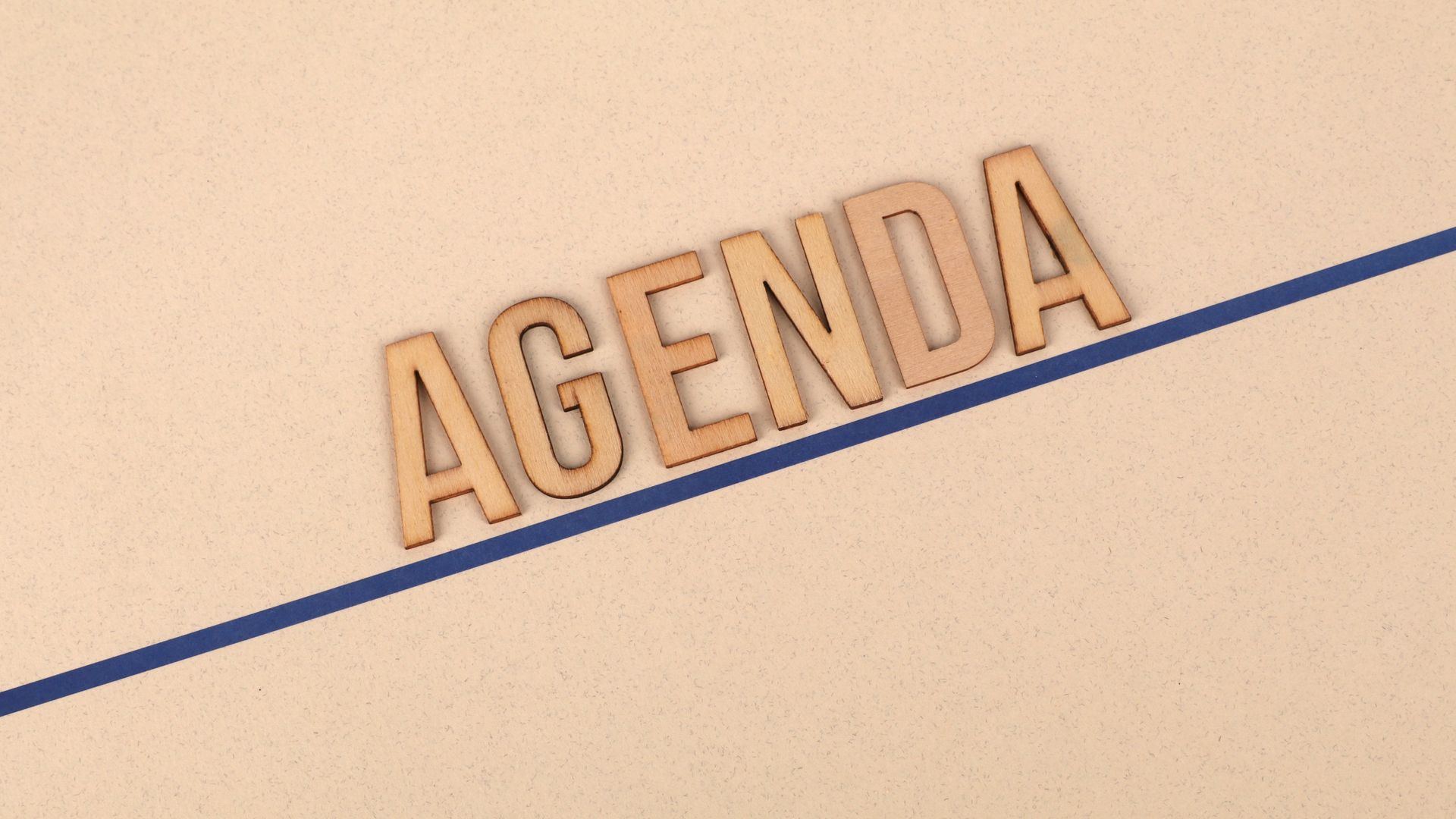 Modafinil Tolerance Break Schedule: A Comprehensive Guide Close-up of wooden 'AGENDA' letters on a beige surface with a blue line, studio setting — modafinil tolerance break schedule