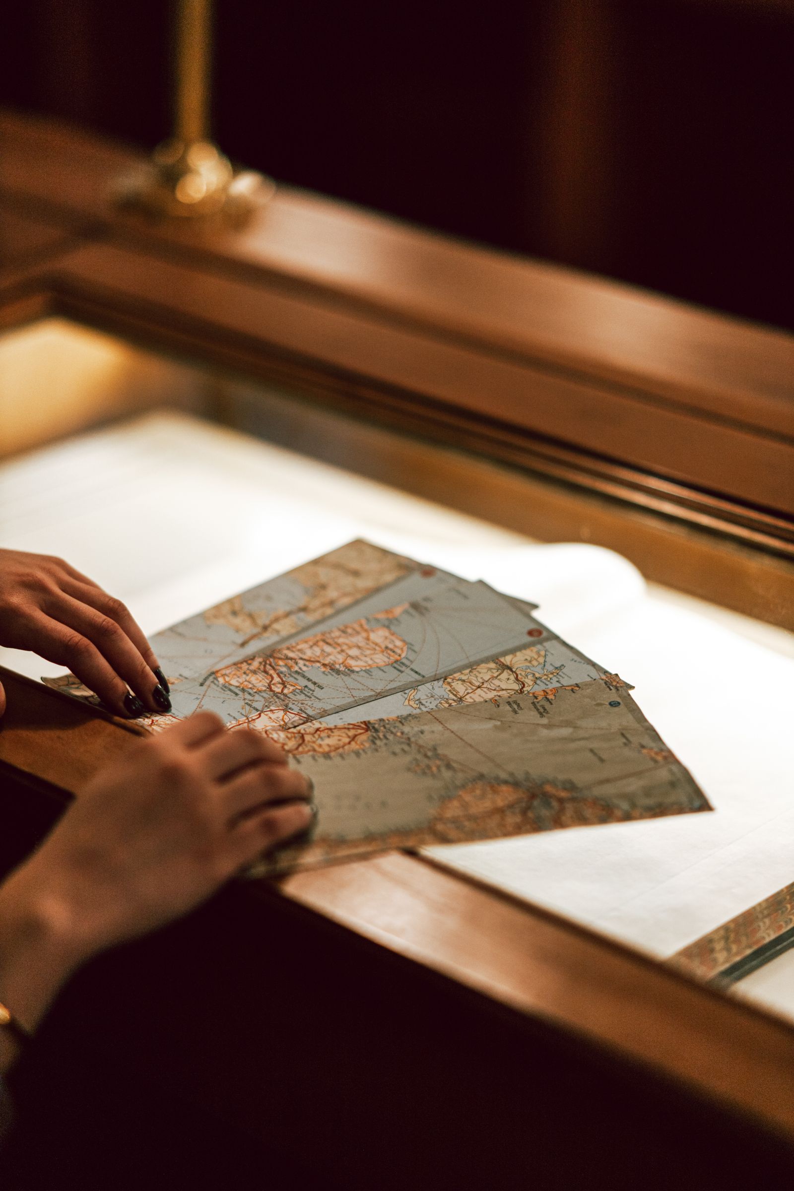 Hands resting on a vintage map