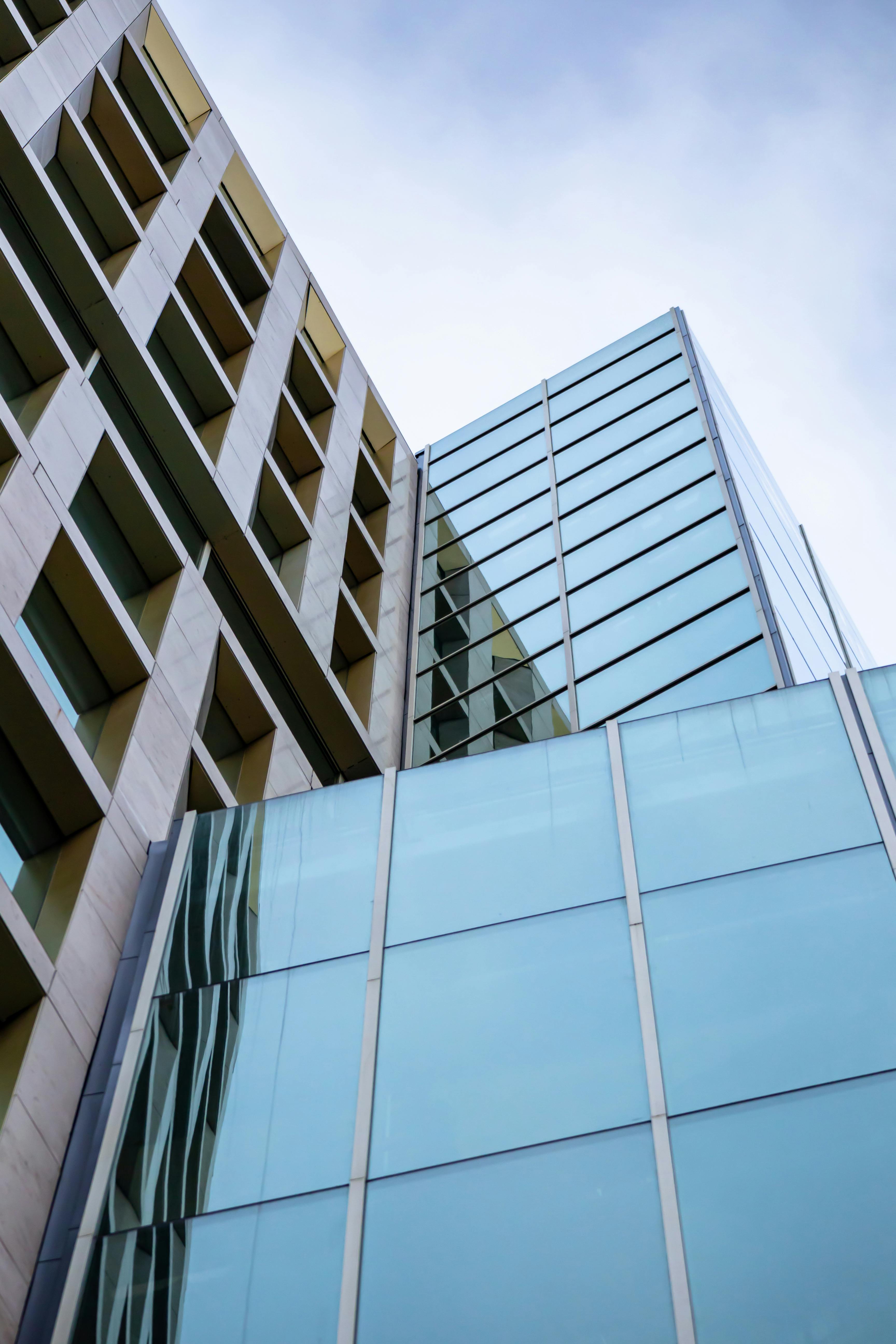 Building exterior combining metal panels and glass for a sleek modern structure