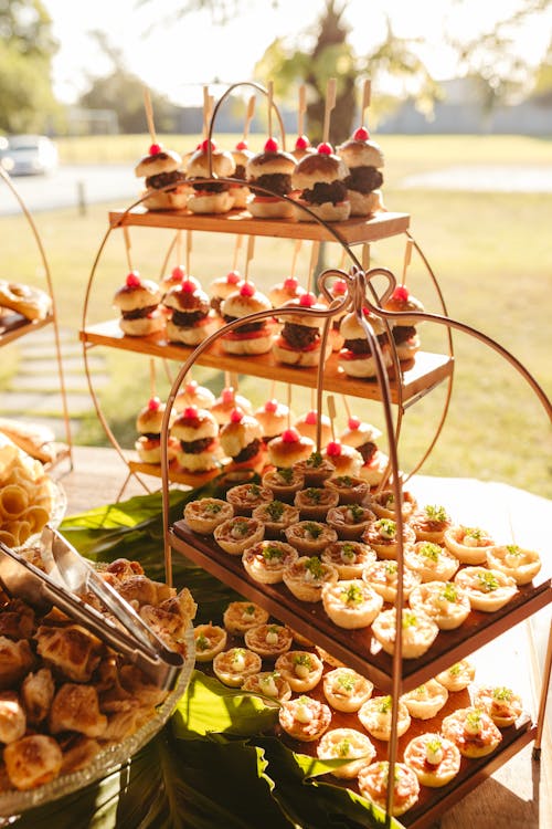 A table with a variety of desserts and appetizers