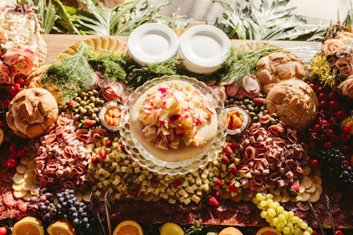 A large platter of food with fruit and vegetables