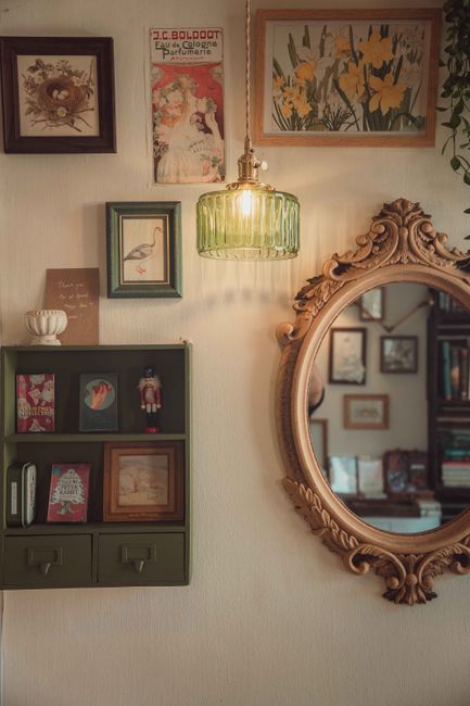 A cozy interior with vintage decor, ornate mirror, and artistic wall art in Ho Chi Minh City.