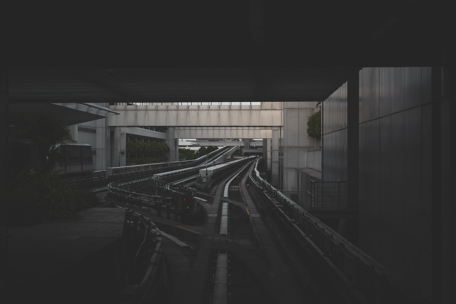 View of a modern urban transit system in Singapore with intricate tracks and architecture.