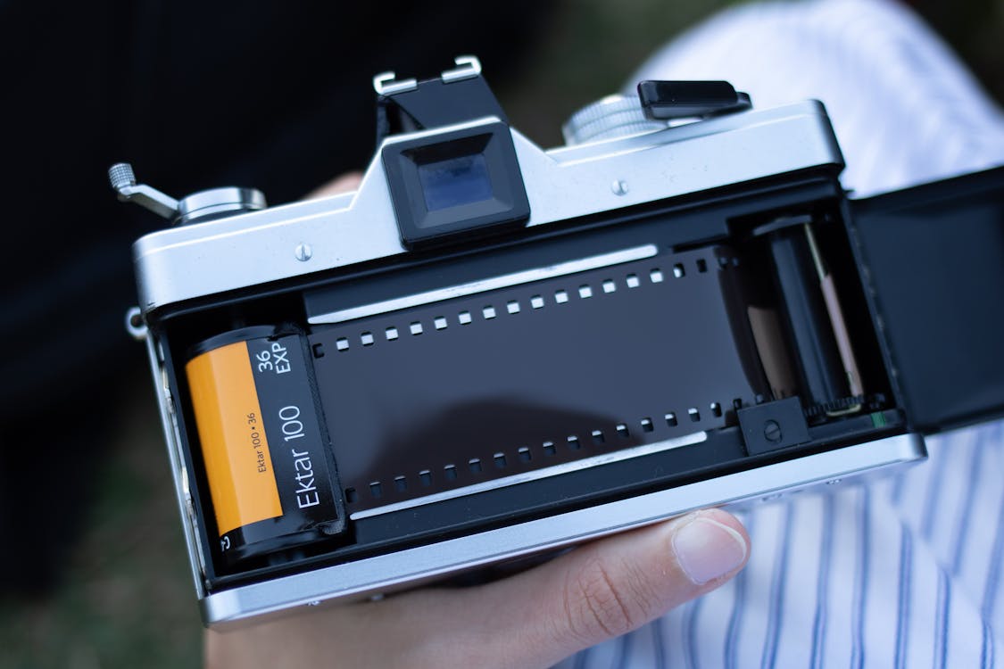 Free Photograph of a Person Holding a Film Camera Stock Photo