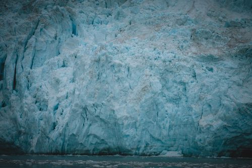 Free A dramatic close-up of a majestic arctic glacier with icy blue textures in nature. Stock Photo