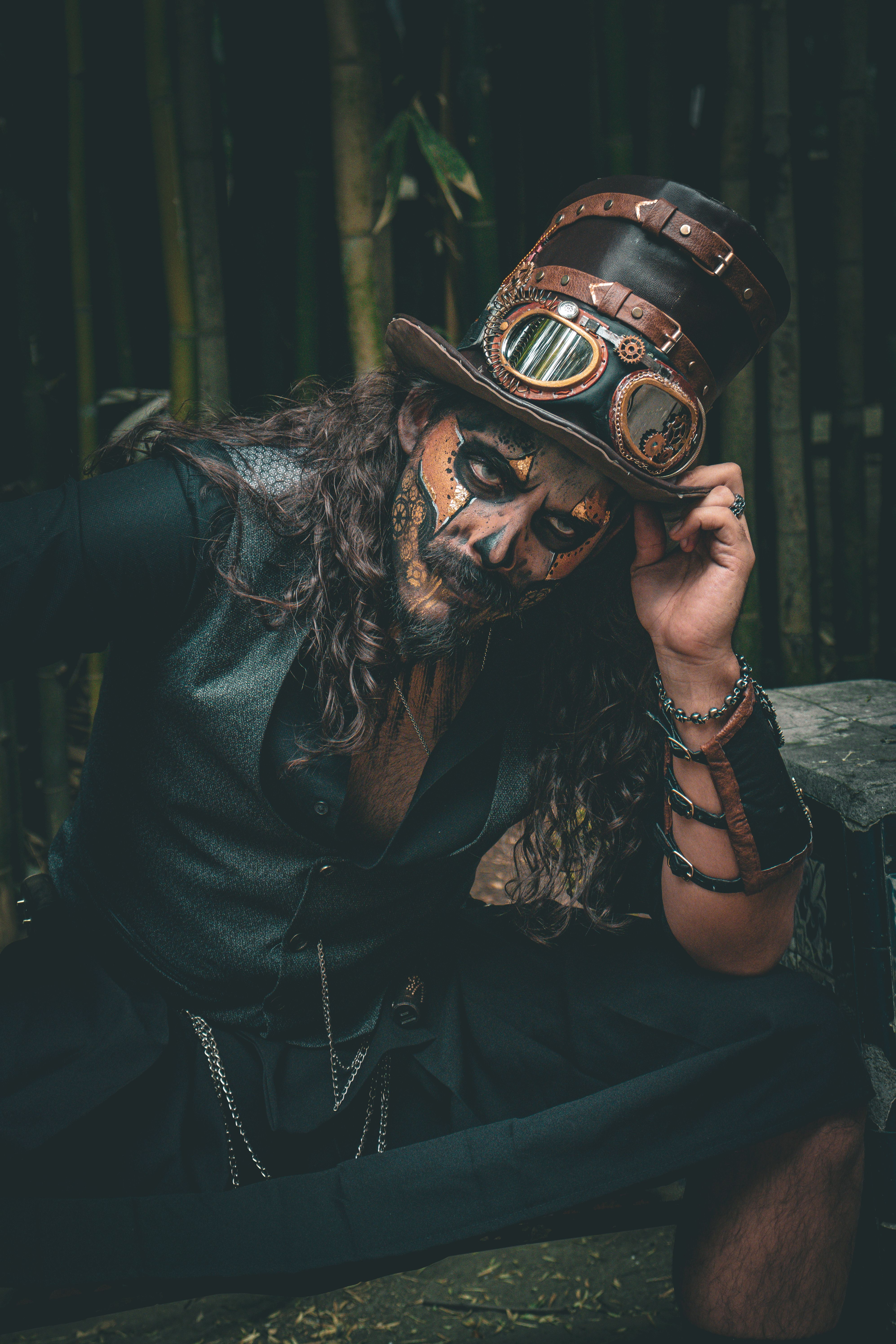 Man Sitting in Cosplay Costume · Free Stock Photo