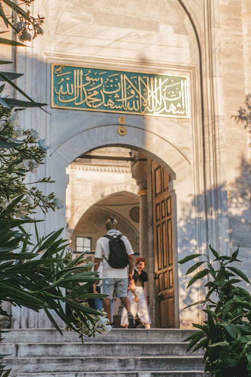 Tourist in Mosque Entrance
