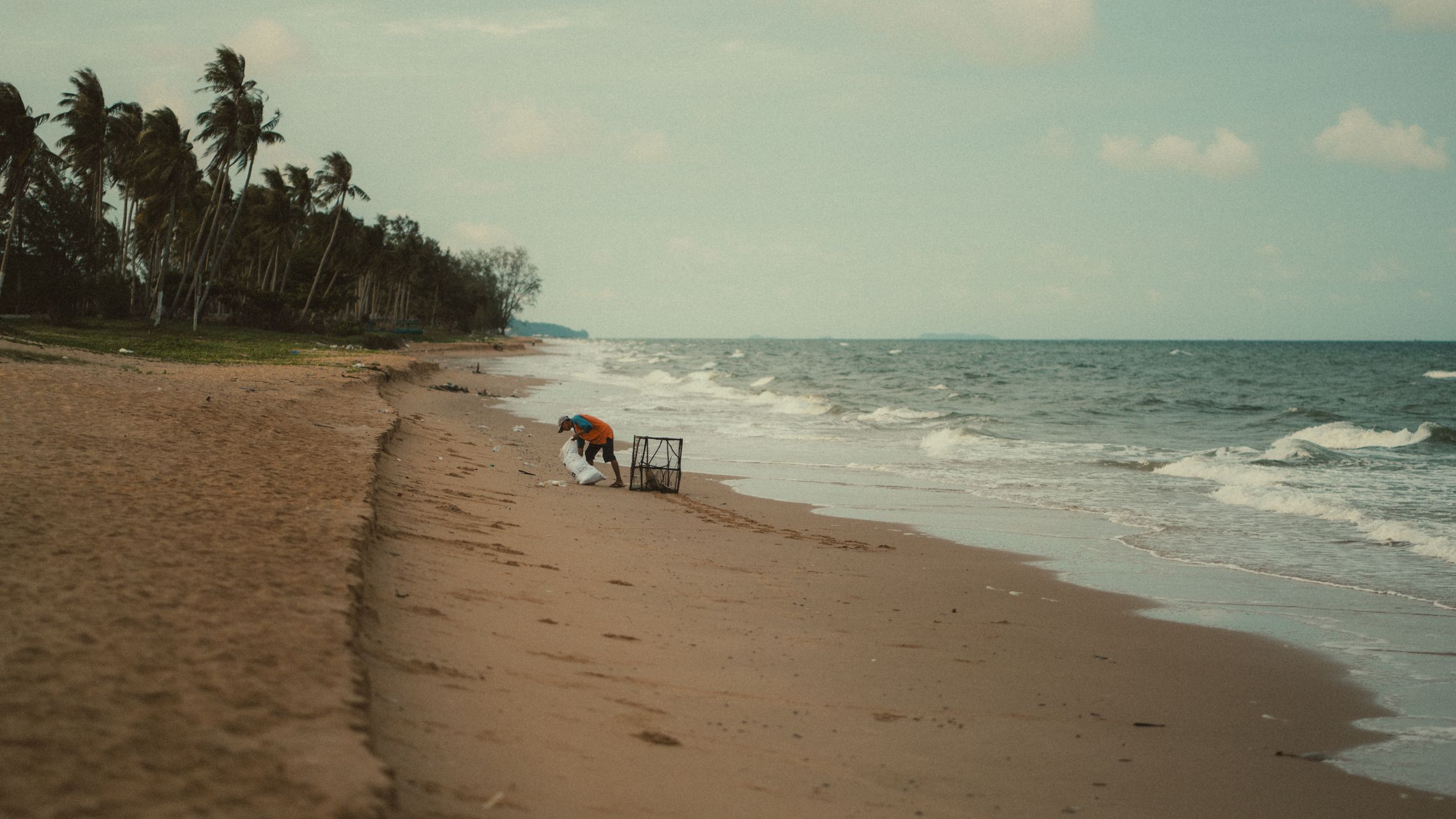 Peaceful day at the beach in Phu Quoc with palm trees and ocean waves.