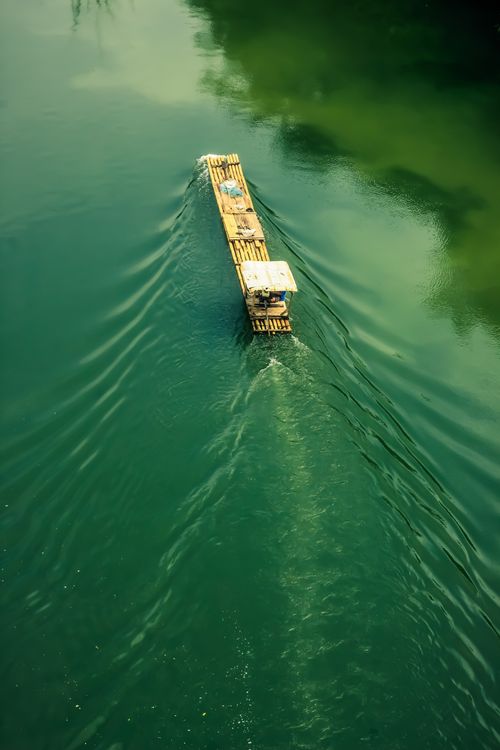 Aerial View of a Bamboo Raft Floating Down the River · Free Stock Photo