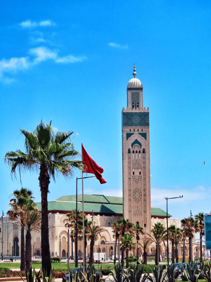 Hassan II Mosque behind palm trees in Casablanca, Morocco