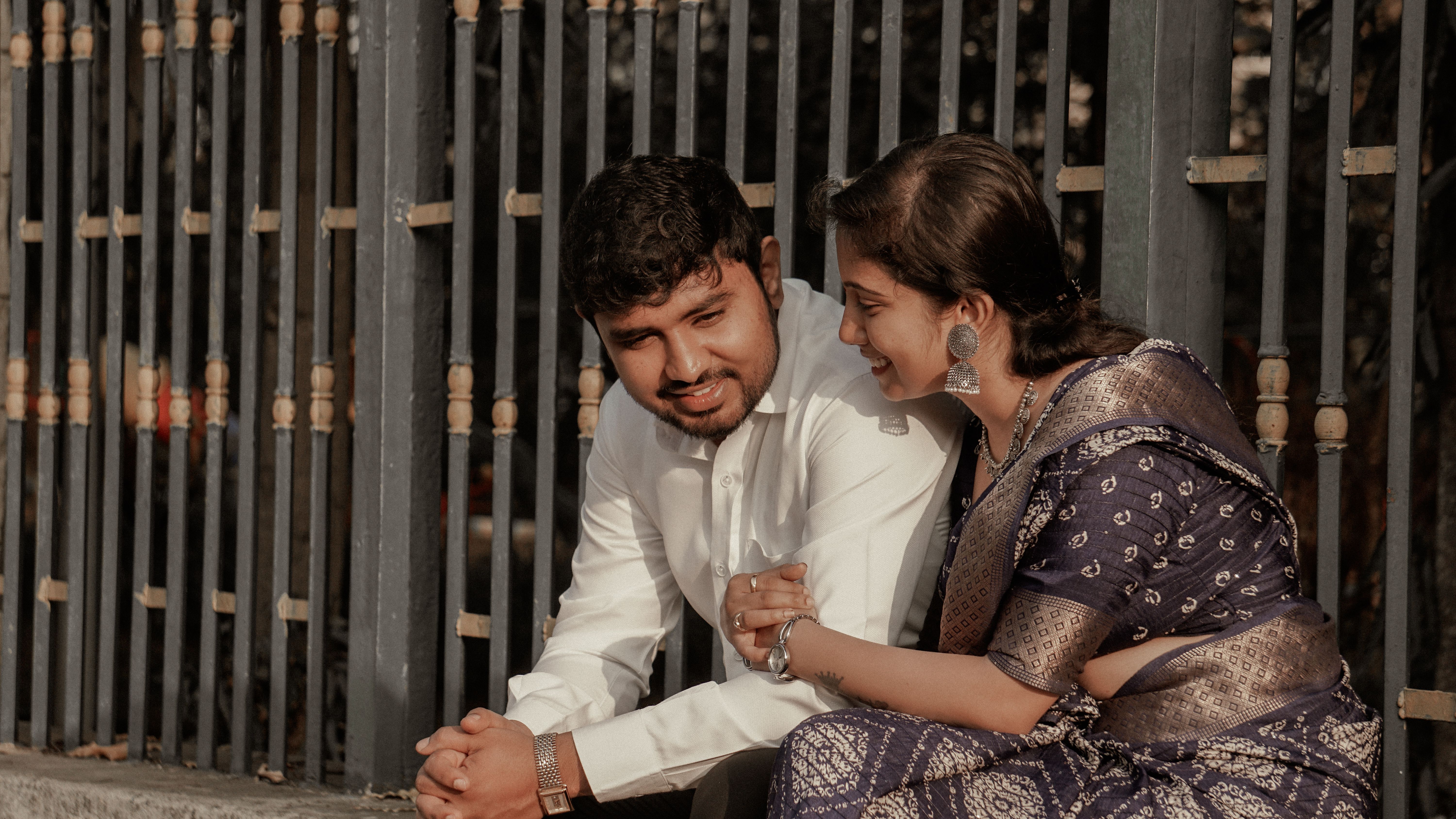 Young Couple in Traditional Clothing Sitting Together · Free Stock Photo