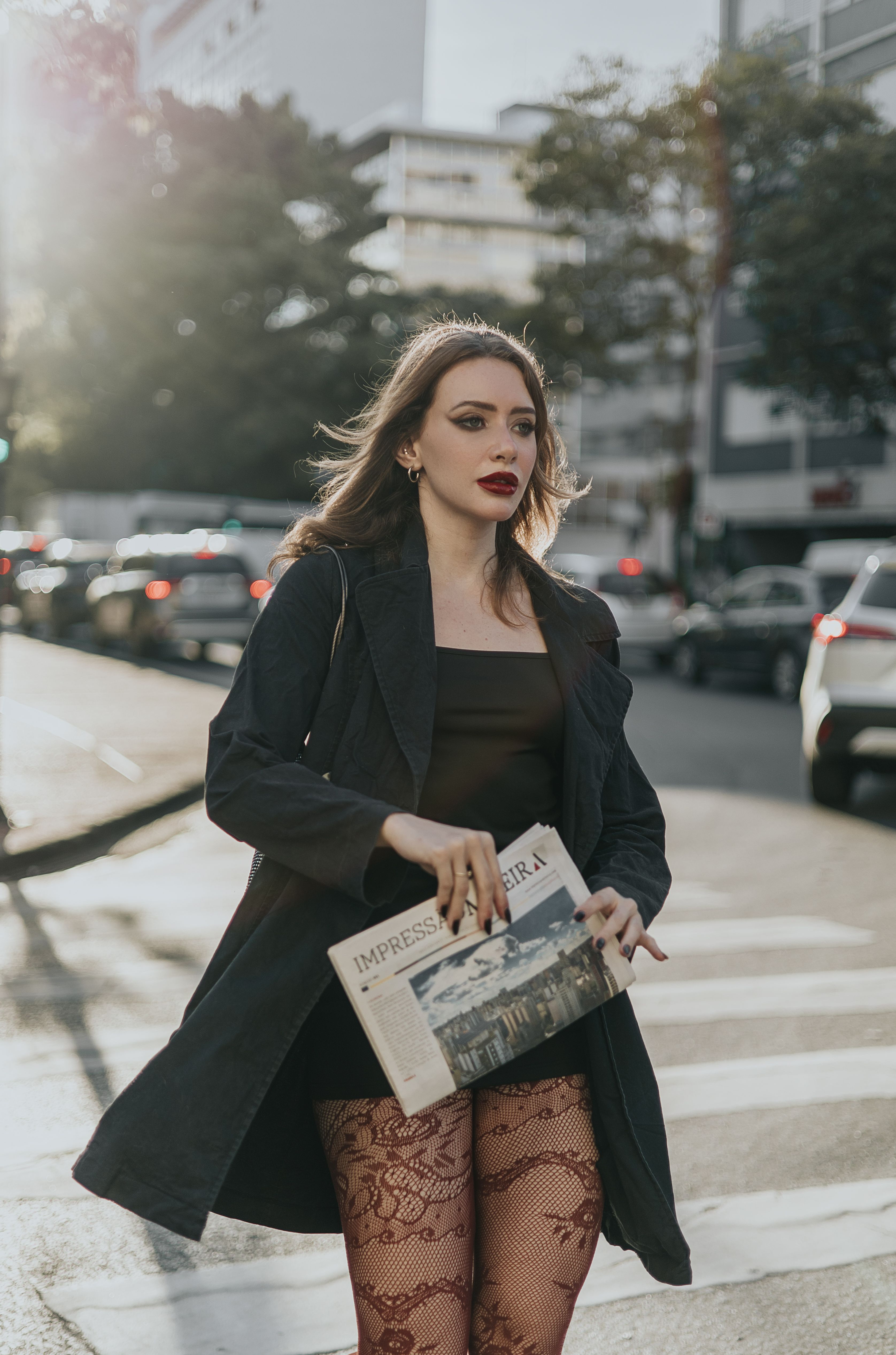 Brunette Woman in Black Coat Crossing Street in City · Free Stock Photo