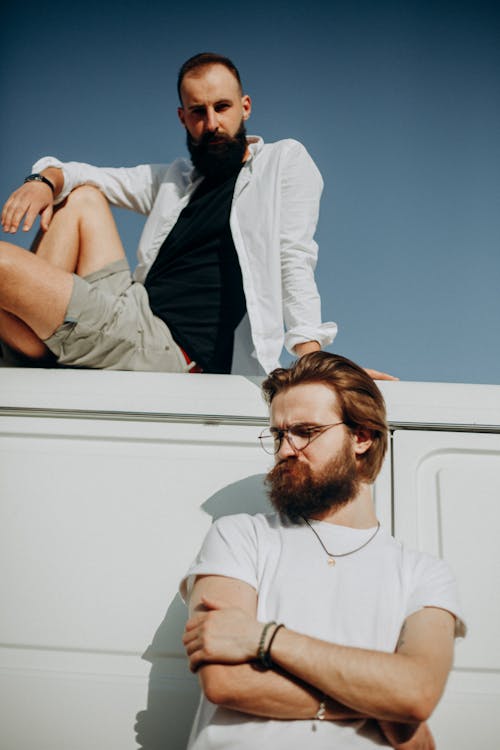 Photo of Two Men Wearing White Top