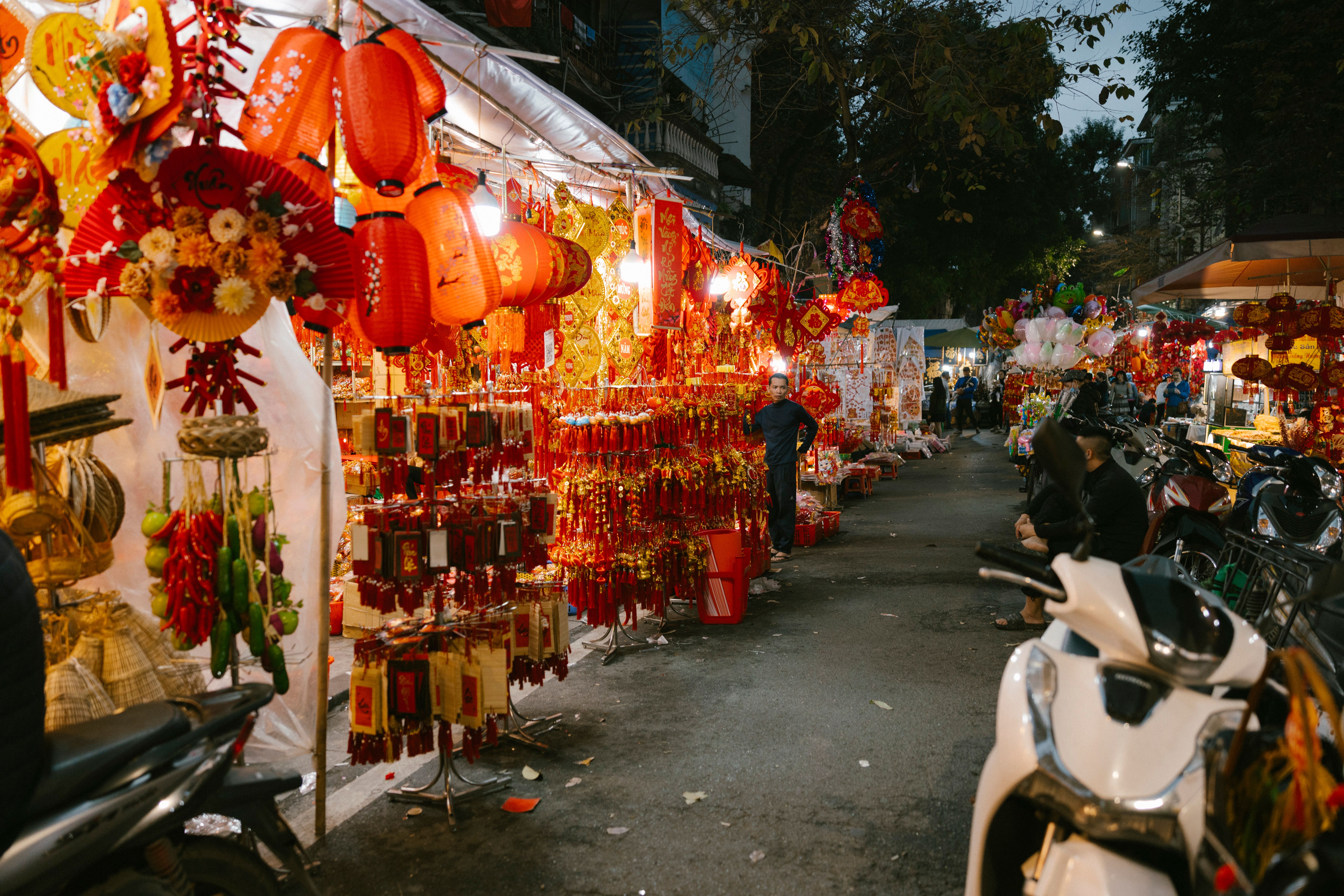Night market scene with colorful lanterns and festival decorations, ideal for cultural and travel th