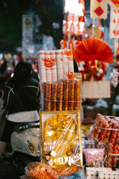 Explore the colorful night market in Vietnam with festive decorations and glowing lights.