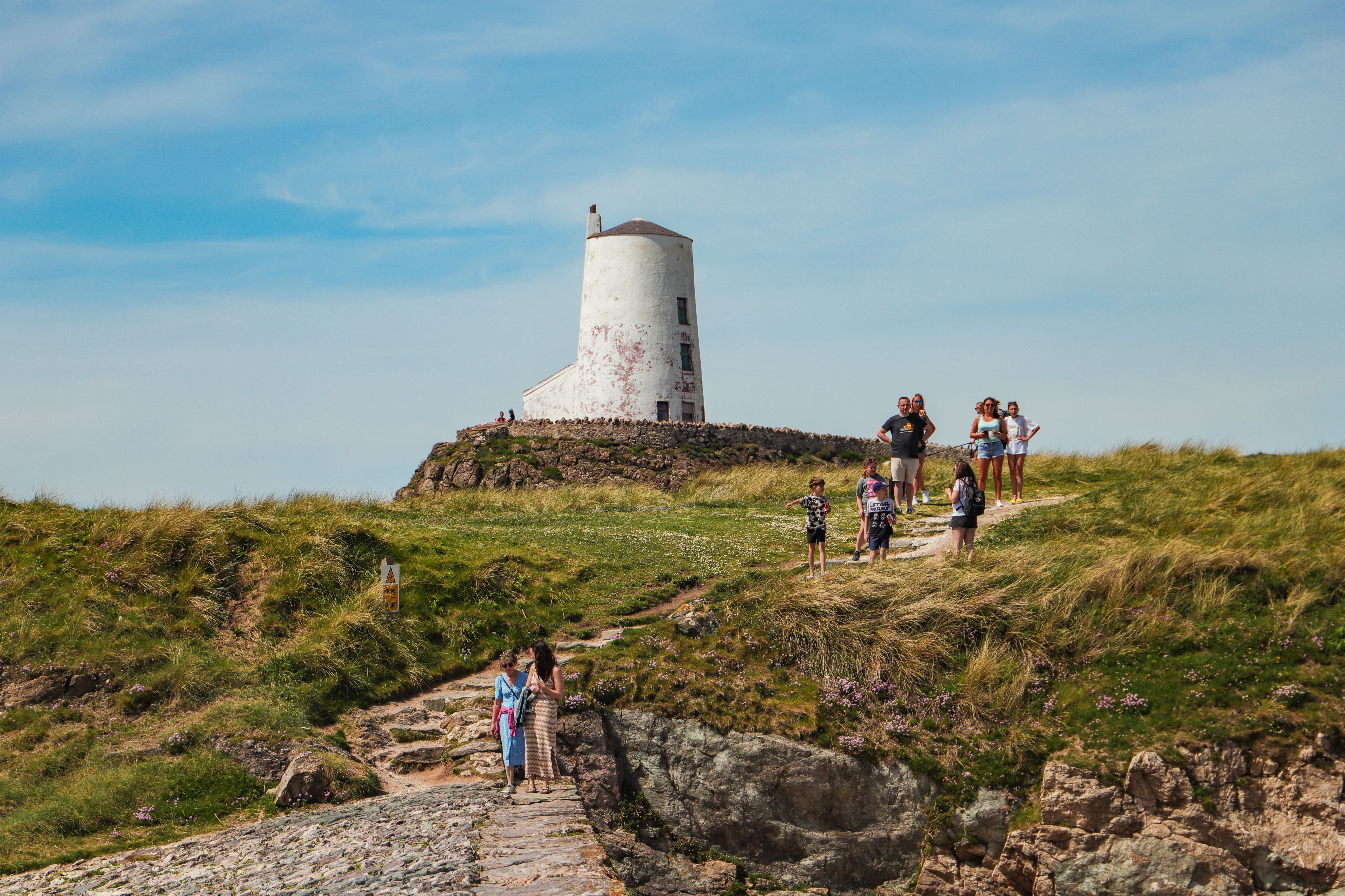 Tourists by Twr Mawr Lighthouse · Free Stock Photo