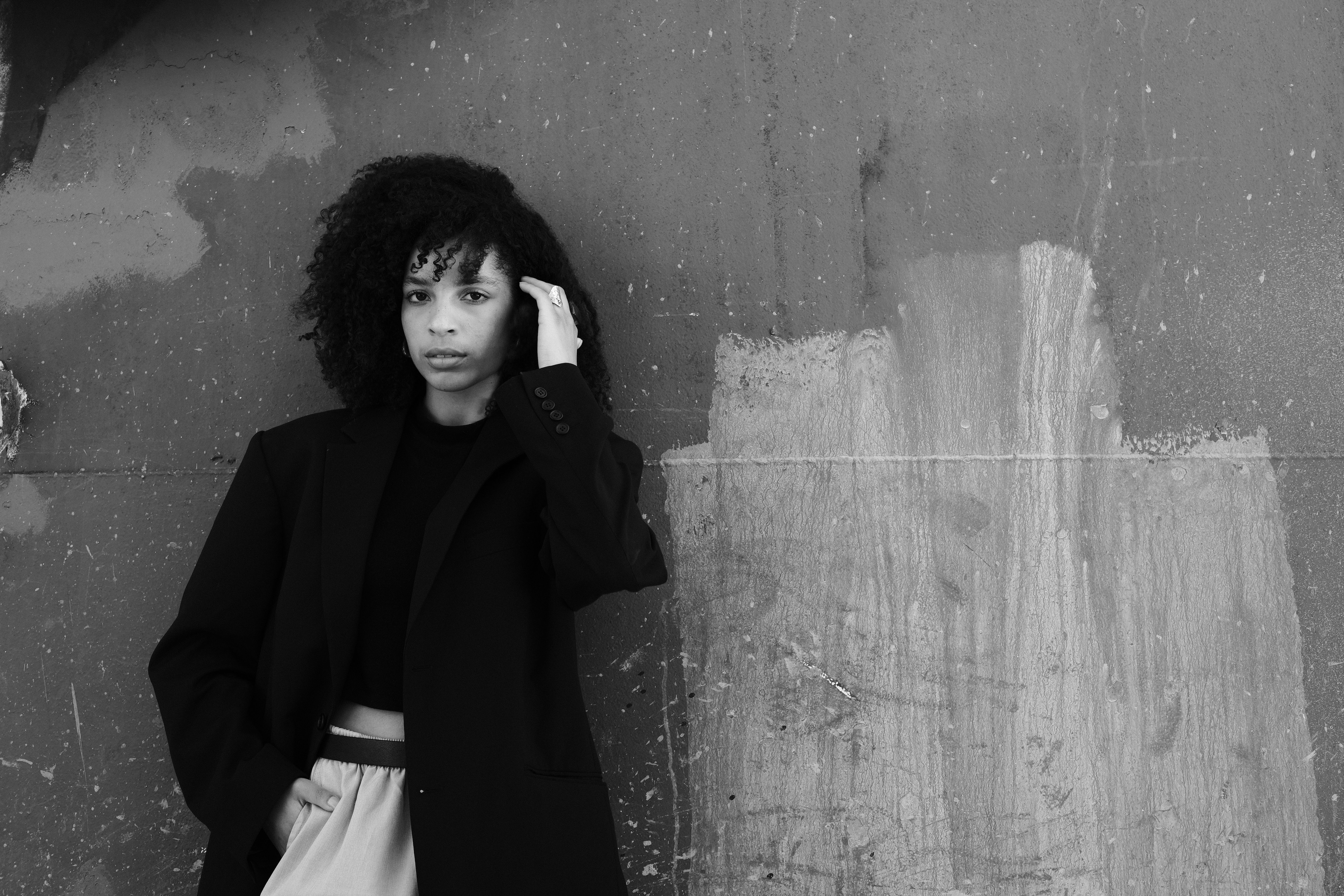 Woman with Curly Hair in Black and White · Free Stock Photo