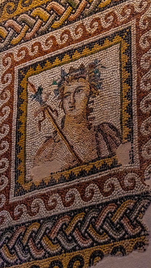 A mosaic with a woman holding a flower