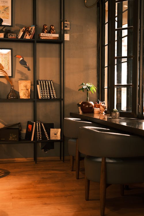 A room with a desk and bookshelves