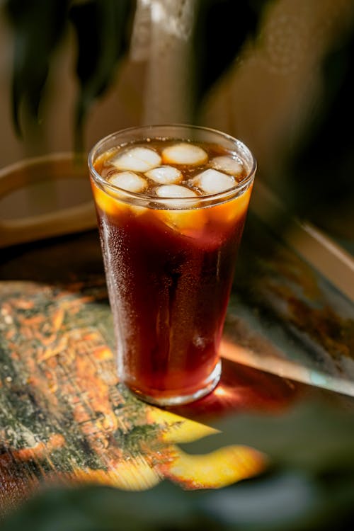 Free A glass of iced coffee on a table Stock Photo