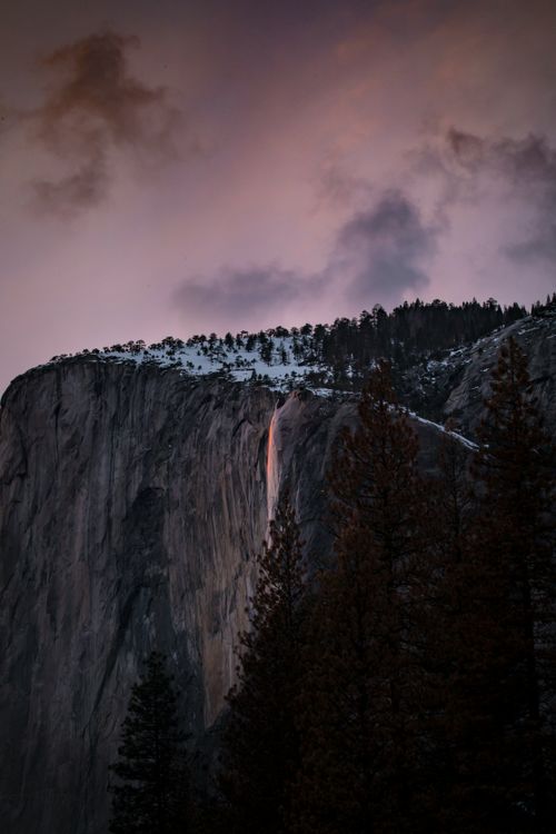 Free Capture of Horsetail Fall glowing at sunset in Yosemite National Park. Stock Photo