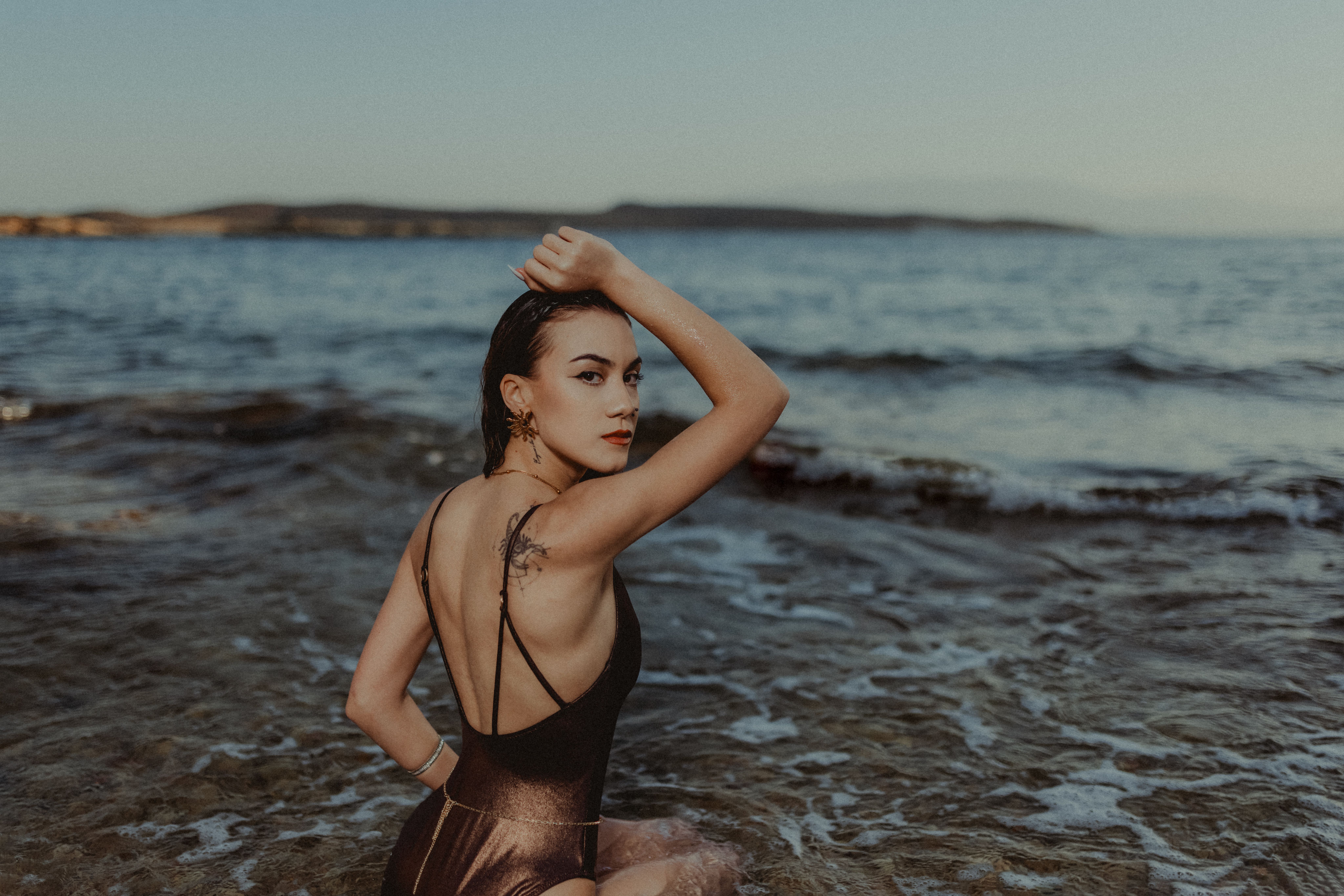 Woman in Bathing Suit Posing in Water on Beach · Free Stock Photo