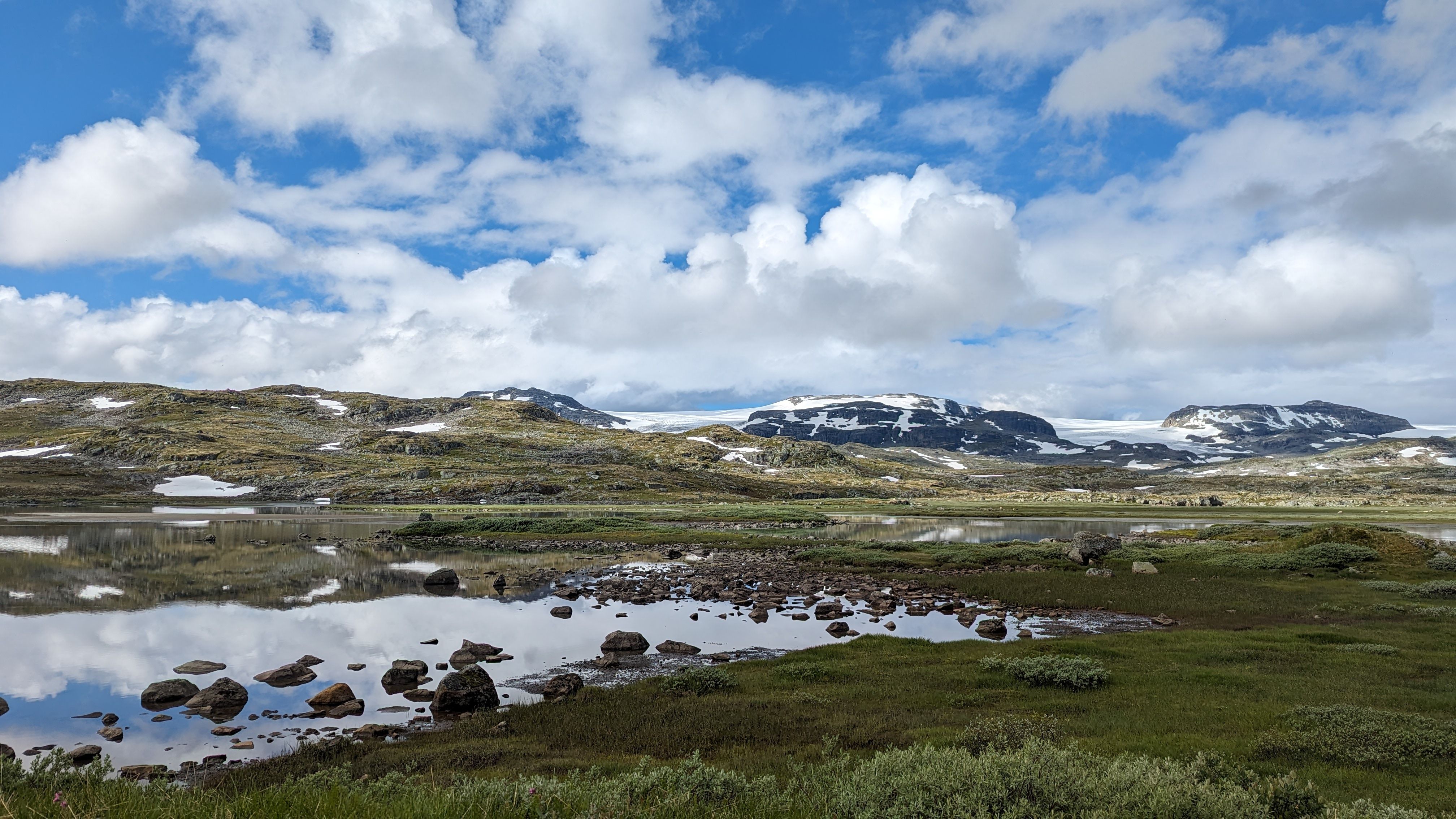 Breathtaking view of mountains and lakes in Vestland, Norway, capturing nature's serenity.